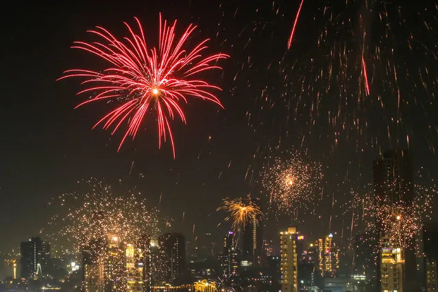 Fireworks illuminate the night sky on the occasion of the Diwali festival in Mumbai, India on November 12, 2023. (Photo by Divyakant Solanki/EPA/EFE)