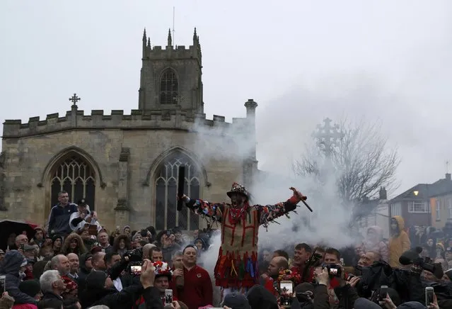 The Fool Dale Smith is smoked as he starts the traditional annual Haxey Hood game in Haxey, Britain January 6, 2017. (Photo by Darren Staples/Reuters)