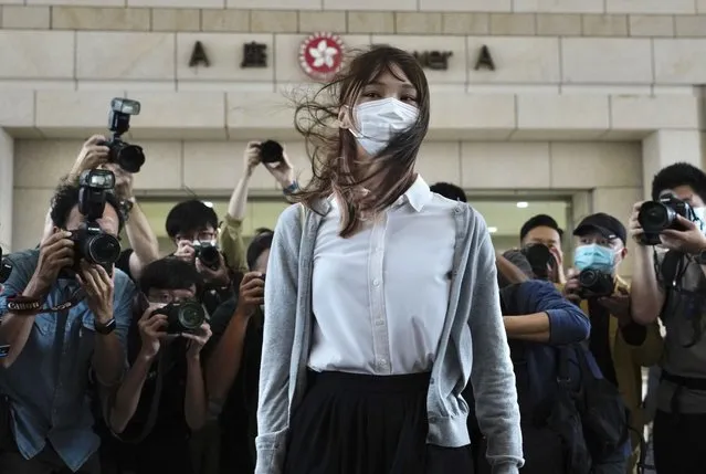 Hong Kong activist Agnes Chow arrives at a court in Hong Kong, Monday, November 23, 2020. One of Hong Kong’s best-known pro-democracy activists, who moved to Canada to pursue further studies, said she would not return to the city to meet her bail conditions, becoming the latest politician to flee Hong Kong under Beijing's crackdown on dissidents. (Photo by Vincent Yu/AP Photo)