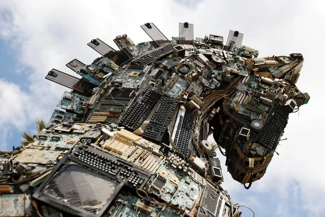 The head of a “Cyber Horse”, made from discarded electronic bits, is seen on display near the entrance to the Cyber Week conference at Tel Aviv University, Israel on July 21, 2021. (Photo by Amir Cohen/Reuters)
