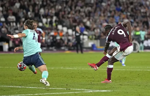 West Ham’s Michail Antonio, right, scores his side’s third goal during the English Premier League soccer match between West Ham United and Leicester City and at the London Stadium in London,  Monday, August 23, 2021. (Photo by Alastair Grant/AP Photo)