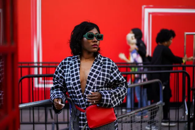 A fashionista stands outside the BFC Showspace during London Fashion Week Women's A/W19 in London, Britain February 15, 2019. (Photo by Henry Nicholls/Reuters)