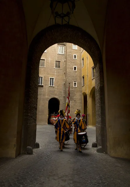 Vatican Swiss guards march after a swearing-in ceremony, at the Vatican, Wednesday, May 6, 2015. (Photo by Alessandra Tarantino/AP Photo)