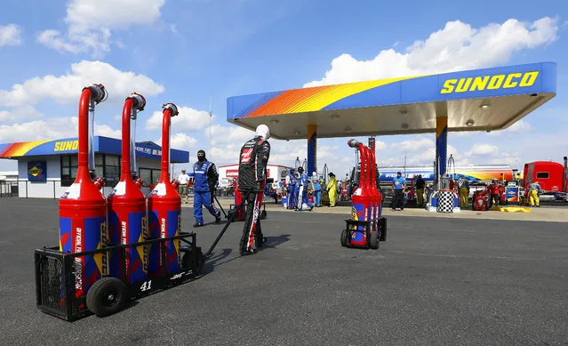 Crews head to the gas pumps to refill tanks during a NASCAR Cup Series auto race at Talladega Superspeedway, Sunday, April 28, 2019, in Talladega, Ala. (Photo by Butch Dill/AP Photo)
