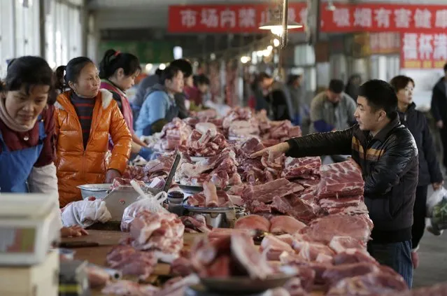 Meat stalls are seen at a market in Beijing, China, March 25, 2016. (Photo by Jason Lee/Reuters)