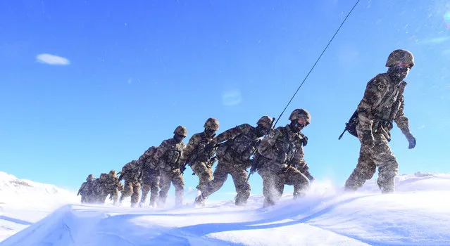 Frontier soldiers march in snow on February 26, 2019 in Ngari Prefecture, Tibet Autonomous Region of China. Frontier soldiers patrol under cold weather in Ngari. (Photo by Liu Xiaodong/VCG via Getty Images)