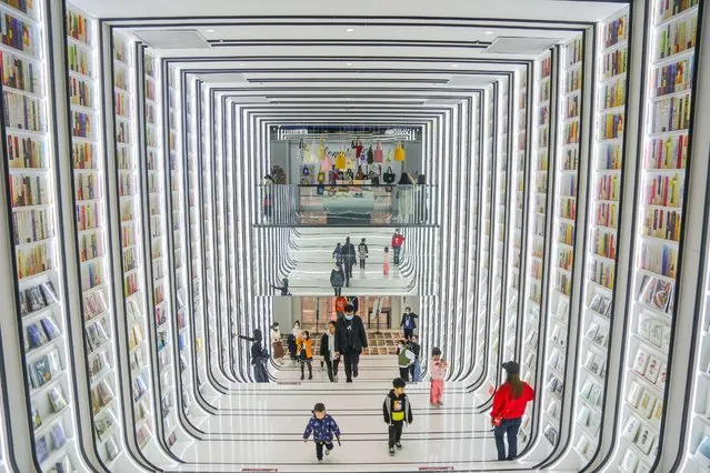 This photo taken on December 15, 2021 shows people visiting a book store in Foshan in China's southern Guangdong province. (Photo by AFP Photo/China Stringer Network)