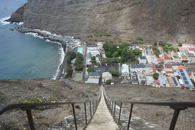 The city of Jamestown is pictured from the top of Jacob’s Ladder, a massive staircase carved into the side of a mountain on the remote island of St. Helena, Friday, February 23, 2024. The 600-foot-high stairway was originally a donkey-powered cart track used to transport goods in and out of the city. (Photo by Nicole Evatt/AP Photo)