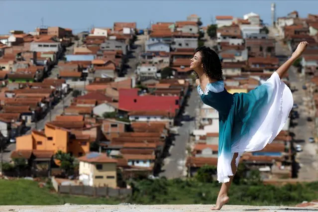 Vitoria Bueno, a 16-year-old dancer whose genetic condition left her without arms, poses for a picture in her neighborhood in Santa Rita do Sapucai, Brazil, February 7, 2021. (Photo by Ueslei Marcelino/Reuters)