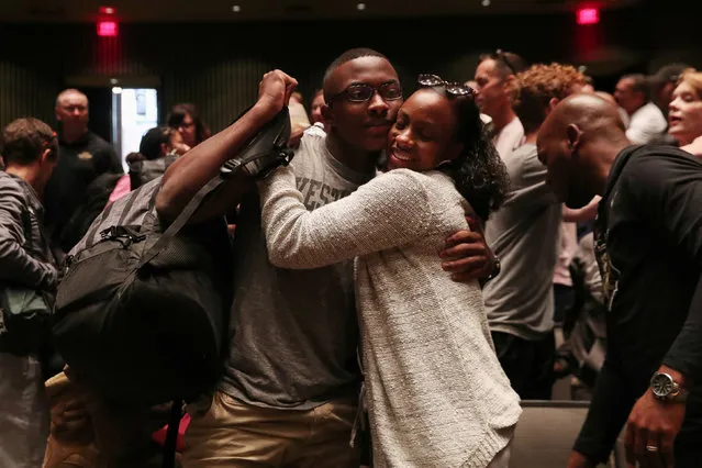 A U.S. Army cade candidate embraces a family member during Reception Day for the class of 2023 at the West Point Academy in West Point, New York, U.S., July 1, 2019. (Photo by Shannon Stapleton/Reuters)