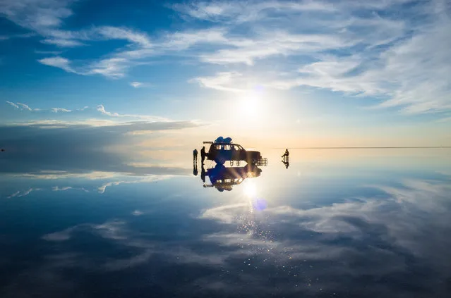 “Floating car”. Salar de Uyuni is miracle. I was so moved of this landscape. I walked away from the car and took this photo with complete silence. Photo location: Uyuni, Bolivia. (Photo and caption by Takashi Nakagawa/National Geographic Photo Contest)