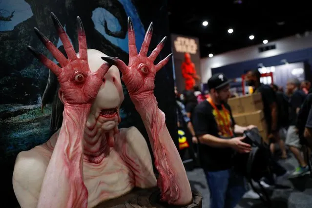Attendees are greeted by a sculpture from the movie Pan's Labyrinth at the pop culture festival Comic Con International during opening night in San Diego, California, July 17, 2019. (Photo by Mike Blake/Reuters)