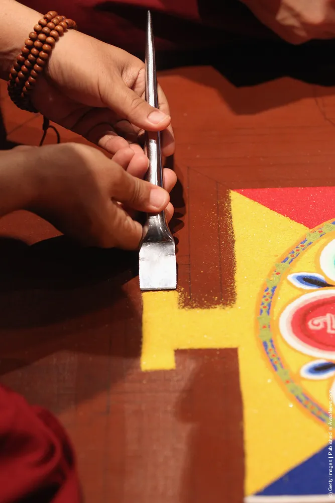 Tibetan Monks From The Panchen Lama's Monastery Create A Sand Mandala Artwork