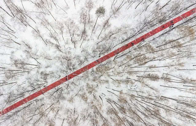 People walk at the art installation “Nowhere” by Gregory Orekhov at the Malevich park near the village of Razdory, outside Moscow, Russia February 6, 2022. (Photo by Maxim Shemetov/Reuters)