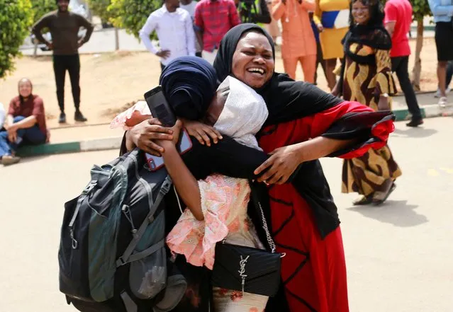 A family reacts after seeing their daughter, one of the Nigerian students who arrived from Ukraine after fleeing the Russian invasion, in Abuja, Nigeria, March 4, 2022. (Photo by Afolabi Sotunde/Reuters)