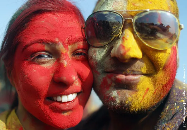 Revelers celebrate the Indian festival of Holi on a boat cruise around part of Manhattan