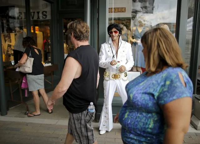 Elvis Presley tribute artist Dave Hodgins of Angus, Ontario greets visitors during the four-day Collingwood Elvis Festival in Collingwood, Ontario July 25, 2015. (Photo by Chris Helgren/Reuters)