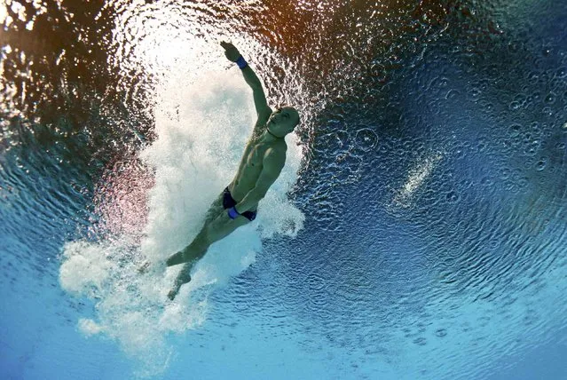 Vadim Kaptur of Belarus is seen underwater during the mixed team event final at the Aquatics World Championships in Kazan, Russia July 29, 2015. (Photo by Stefan Wermuth/Reuters)