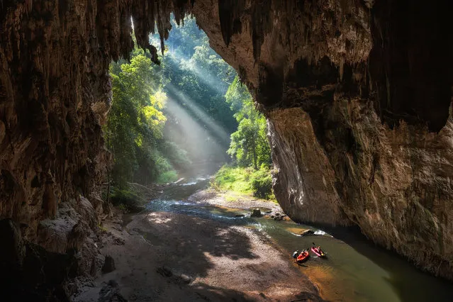 “Tham Lod Cave”. One of the most spectacular natural caves I've ever adventured into, Tham Lod is a piece Mother Nature's masterpieces in the Mae Hong Son region of Northern Thailand. The Lod is a natural limestone cave system, its main feature is the freshwater stream which runs through the middle of the cave for about 200-300 meters. Photo location: Tham Lod Cave, Thailand. (Photo and caption by Drew Hopper/National Geographic Photo Contest)