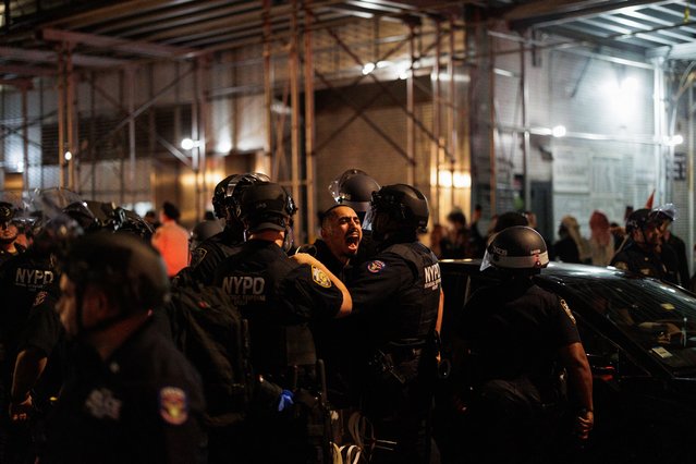 New York City police officers arrest a man during a “Flood Manhattan for Lebanon” protest in New York on September 24, 2024. Tens of thousands of people have fled their homes in Lebanon as Israeli strikes pummelled the country, the UN said September 24, calling events “extremely alarming”. Israeli air strikes killed at least 558 people on September 23, including 50 children and 94 women, according to Lebanon's health ministry. (Photo by Paul Frangipane/AFP Photo)