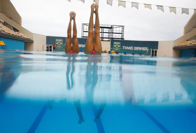 Brazil's synchronised swimmers Luisa Borges and Maria Eduarda Miccuci perform during a training session at the Rio Olympic Park in Rio de Janeiro, Brazil, April 29, 2016. (Photo by Pilar Olivares/Reuters)