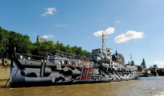 The WWI warship HMS President (1918) which has become a public art work on London's Embankment, called Dazzle Ship London by artist Tobias Rehberger, the ship, one of the last surviving three WWI warships, has been covered in dazzle camouflage print as part of 14 – 18 Now, a programme of events to mark the centenary of World War I. (Photo by Nick Ansell/PA Wire)