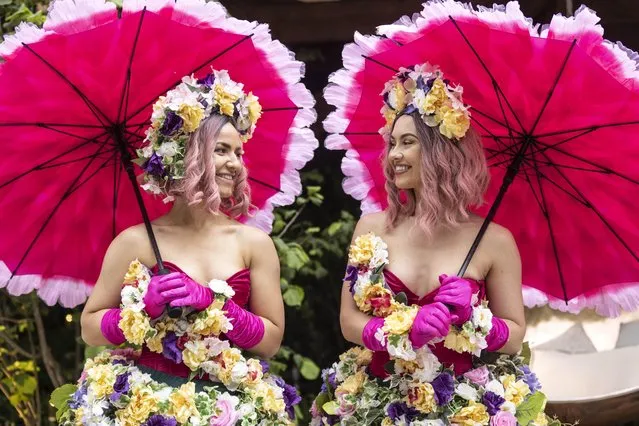 Models wear floral dresses during the RHS Chelsea Flower Show press day, at the Royal Hospital Chelsea, London on Monday, May 23, 2022. (Photo by Richard Pohle/The Times)