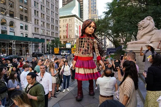 Little Amal, a 3.5-meter-tall puppet of a young Syrian refugee girl is being displayed at New York Public Library on September 15, 2022. Her journey from the Syrian-Turkish border started in July 2021, and she has become a symbol of the struggles of refugees. (Photo by Lokman Vural Elibol/Anadolu Agency via Getty Images)