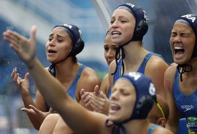 Brazil players yell toward their teammates during a preliminary women's water polo match against Russia at the Summer Olympics in Rio de Janeiro, Brazil, Thursday, August 11, 2016. (Photo by Sergei Grits/AP Photo)