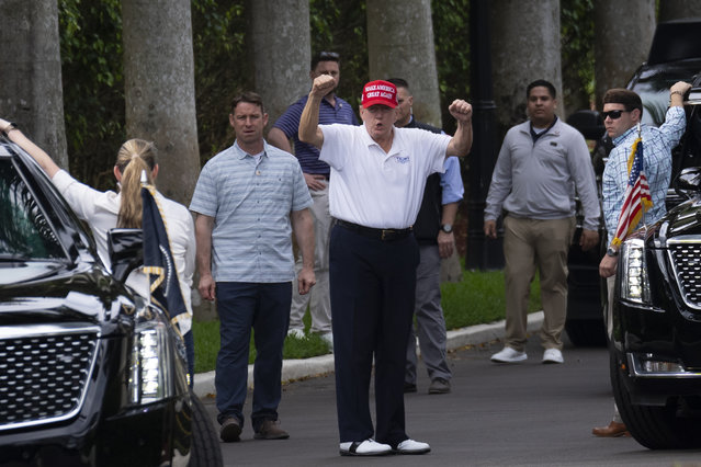 President Donald Trump gestures to supporters gathered for a Presidents Day rally as he leaves the Trump International Golf Club, Monday, February 17, 2025, in West Palm Beach, Fla. (Photo by Ben Curtis/AP Photo)