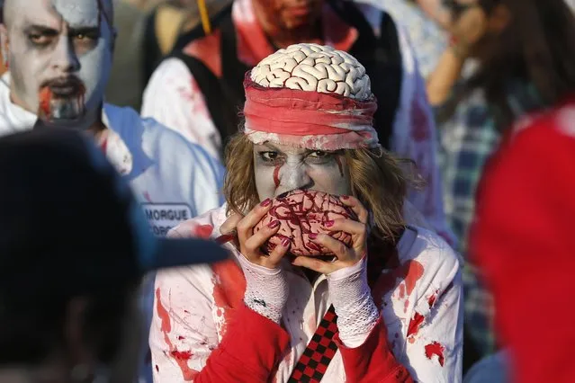 A reveller takes part in a Zombie Walk in Asbury Park, New Jersey October 4, 2014. (Photo by Eduardo Munoz/Reuters)