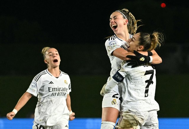 Real Madrid's Spanish forward #22 Athenea del Castillo (C) celebrates scoring her team's second goal with Real Madrid's Spanish defender #07 Olga Carmona during the UEFA Women's Champions League quarter final first leg football match between Real Madrid CF and Arsenal at the Alfredo Di Stefano stadium in Madrid on March 18, 2025. (Photo by Javier Soriano/AFP Photo)