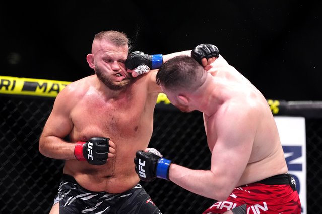 Mick Parkin (right) strikes Marcin Tybura in the heavyweight bout during UFC Fight Night at The O2, London on Saturday, March 22, 2025. (Photo by Adam Davy/PA Wire)