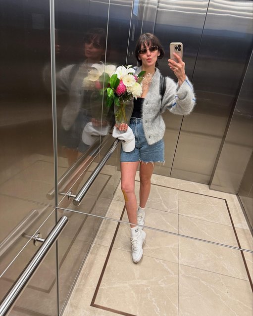 Canadian actress Nina Dobrev in the first decade of April 2025 holds onto a spring bouquet while celebrating wrapping “Bear Country”. (Photo by nina/Instagram)