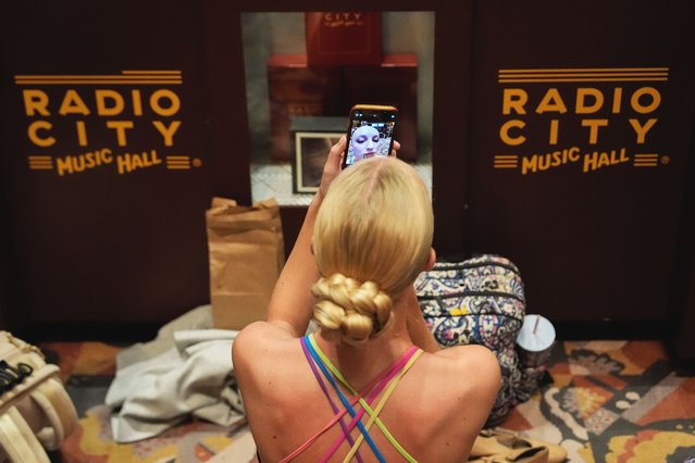 A dancer applies make up before an audition for the Radio City Rockettes at Radio City Music Hall, Tuesday, April 22, 2025, in New York. (Photo by Julia Demaree Nikhinson/AP Photo)