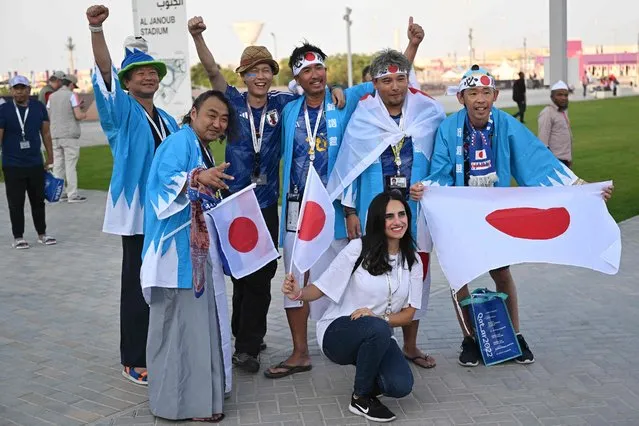 Japan supporters pose as they arrive for the Qatar 2022 World Cup round of 16 football match between Japan and Croatia at the Al-Janoub Stadium in Al-Wakrah, south of Doha on December 5, 2022. (Photo by Andrej Isakovic/AFP Photo)