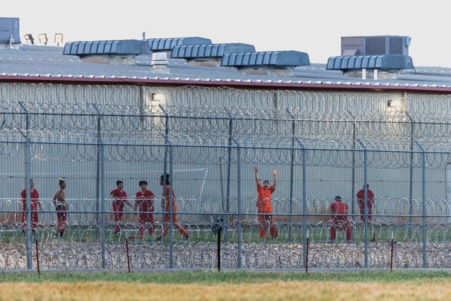 A detainee celebrates scoring a point during a volleyball game, at the Bluebonnet Detention Facility, the facility where Venezuelans at the center of a U.S. Supreme Court ruling are held, in Anson, Texas on April 28, 2025. (Photo by Paul Ratje/Reuters)