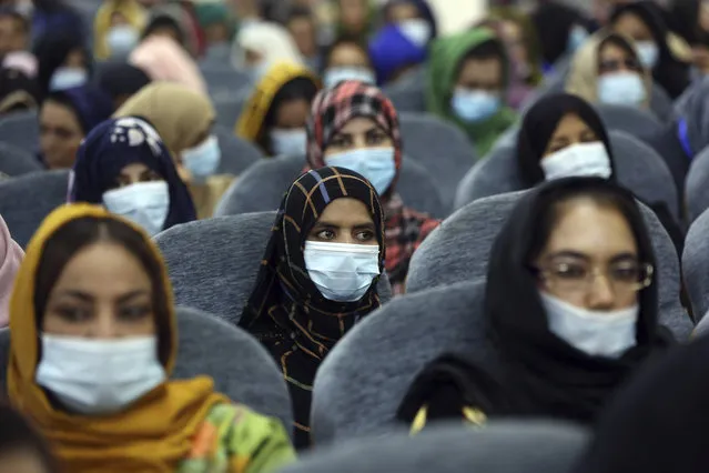 Delegates wearing a protective face masks to help curb the spread of the coronavirus attend an Afghan Loya Jirga meeting in Kabul, Afghanistan, Friday, August 7, 2020. The traditional council opened Friday in the Afghan capital to decide the release of a final 400 Taliban – the last hurdle to the start of negotiations between Kabul’s political leadership and the Taliban in keeping with a peace deal the United States signed with the insurgent movement in February. (Photo by Rahmat Gul/AP Photo)