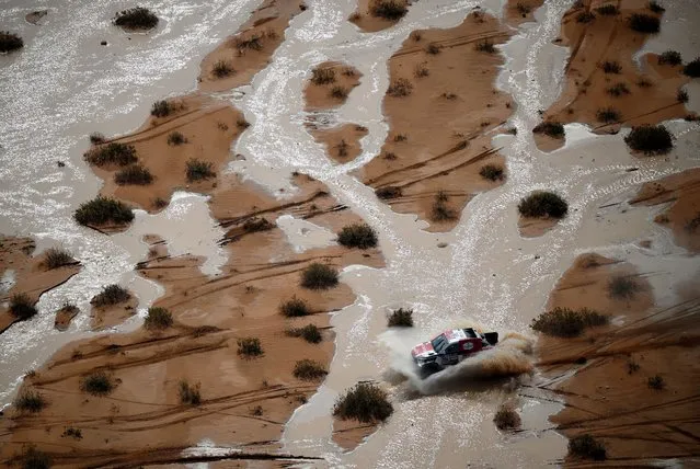 Toyota's driver Giniel De Villiers and co-driver Dennis Murphy of South Africa compete during Stage 9 of the Dakar 2023 rally between Riyadh and Haradh in Saudi Arabia on January 10, 2023. (Photo by Franck Fife/AFP Photo)