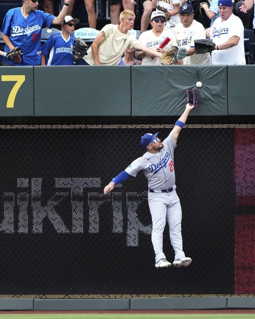 Los Angeles Dodgers left fielder Confort can't make the catch on a two-run double hit by Kansas City Royals' Maikel Garcia during the third inning of a baseball game Saturday, June 28, 2025, in Kansas City, Mo. (Photo by Charlie Riedel/AP Photo)