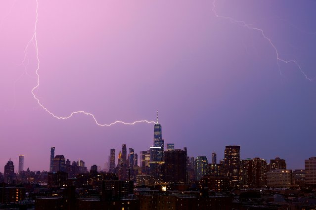 A lightning bolt strikes One World Trade Center in lower Manhattan during a thunderstorm in New York City on August 3, 2024, as seen from Jersey City, New Jersey. (Photo by Gary Hershorn/Getty Images)
