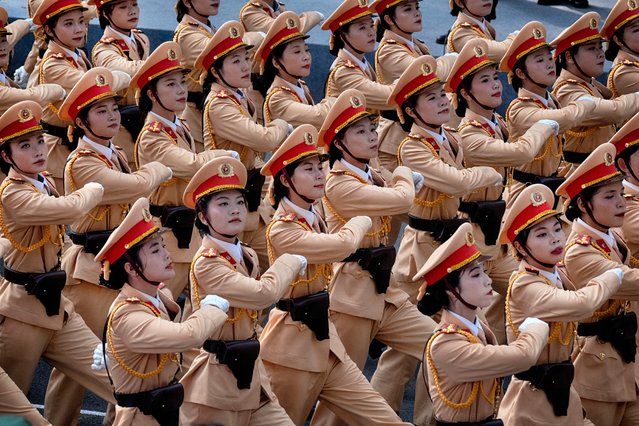 Vietnamese female police officers march during a parade celebrating the 50th anniversary of the end of the Vietnam War on Wednesday, April 30, 2025, in Ho Chi Minh City, Vietnam. (Photo by Richard Vogel/AP Photo)
