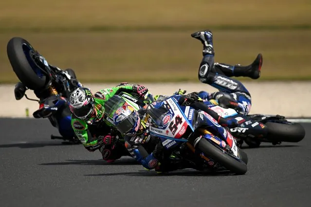 Remy Gardner of Australia (back) falls off the GYTR GRT Yamaha WorldSBK Team Yamaha YZF R1 in the Superpole race during the 2022 MOTUL FIM Superbike World Championship Phillip Island Round at Phillip Island Grand Prix Circuit on February 26, 2023 in Phillip Island, Australia. (Photo by Morgan Hancock/Getty Images)