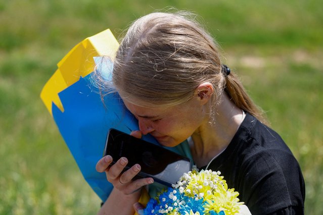 Ukrainian police officer and prisoner of war (POW) Mariana reacts while she speaks with her mother via phone after a swap, amid Russia's attack on Ukraine, at an unknown location in Ukraine on May 31, 2024. (Photo by Valentyn Ogirenko/Reuters)