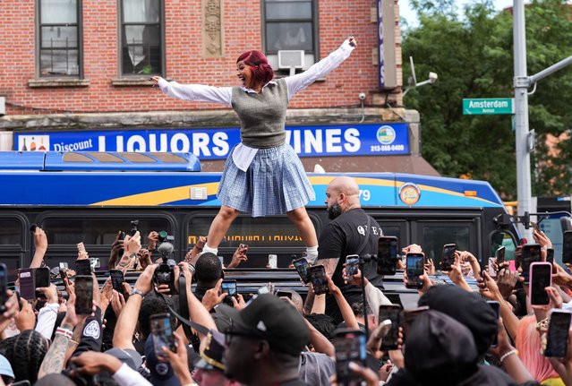 Rapper Cardi B dances on the roof of her vehicle as she hosts a pop-up event at a bodega in Washington Heights in New York City, U.S., on September 13, 2025. (Photo by Adam Gray/Reuters)