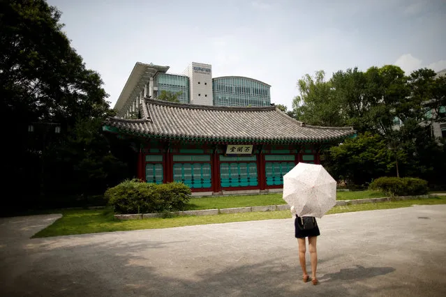 A student stands in front of Bicheondang at the Sungkyunkwan University in Seoul, South Korea, August 1, 2016. (Photo by Kim Hong-Ji/Reuters)