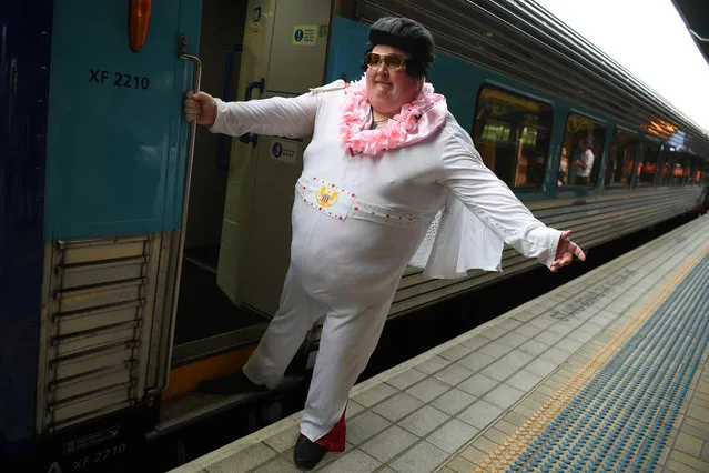 Sean Wright poses for a photo before boarding the Elvis Express, bound for Parkes for the Elvis festival, at Central Station in Sydney, Australia, January 9, 2020. (Photo by Dean Lewins/AAP Image via Reuters)