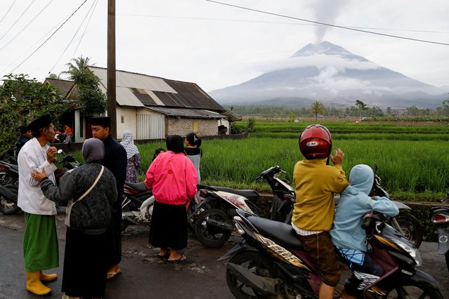 Local residents gather as Mount Semeru volcano spews volcanic ash during an eruption in Supiturang village in Lumajang, East Java province, Indonesia, on November 20, 2025. (Photo by Dipta Wahyu/Reuters)