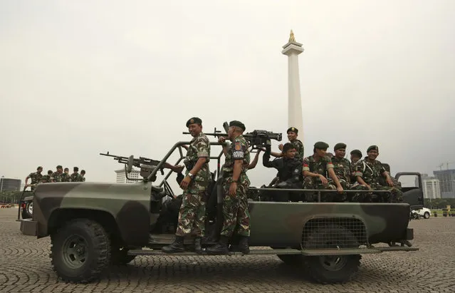 Indonesian soldiers patrol at Monas, the national monument, in Jakarta, Indonesia, Thursday, November 3, 2016. Indonesian police are planning a massive show of force in the capital Jakarta on Friday to contain a much-hyped protest by Muslim hardliners against the city's popular governor that threatens to ignite the country's religious and racial flashpoints. (Photo by Achmad Ibrahim/AP Photo)