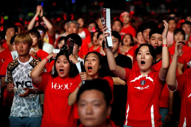 In this Monday, June 18, 2018, file photo, South Korean soccer fans react as they watch a live broadcasting of the Group F World Cup soccer match between South Korea and Sweden at a public viewing venue in Seoul, South Korea. (Photo by . (Photo by /Reuters)/Reuters)